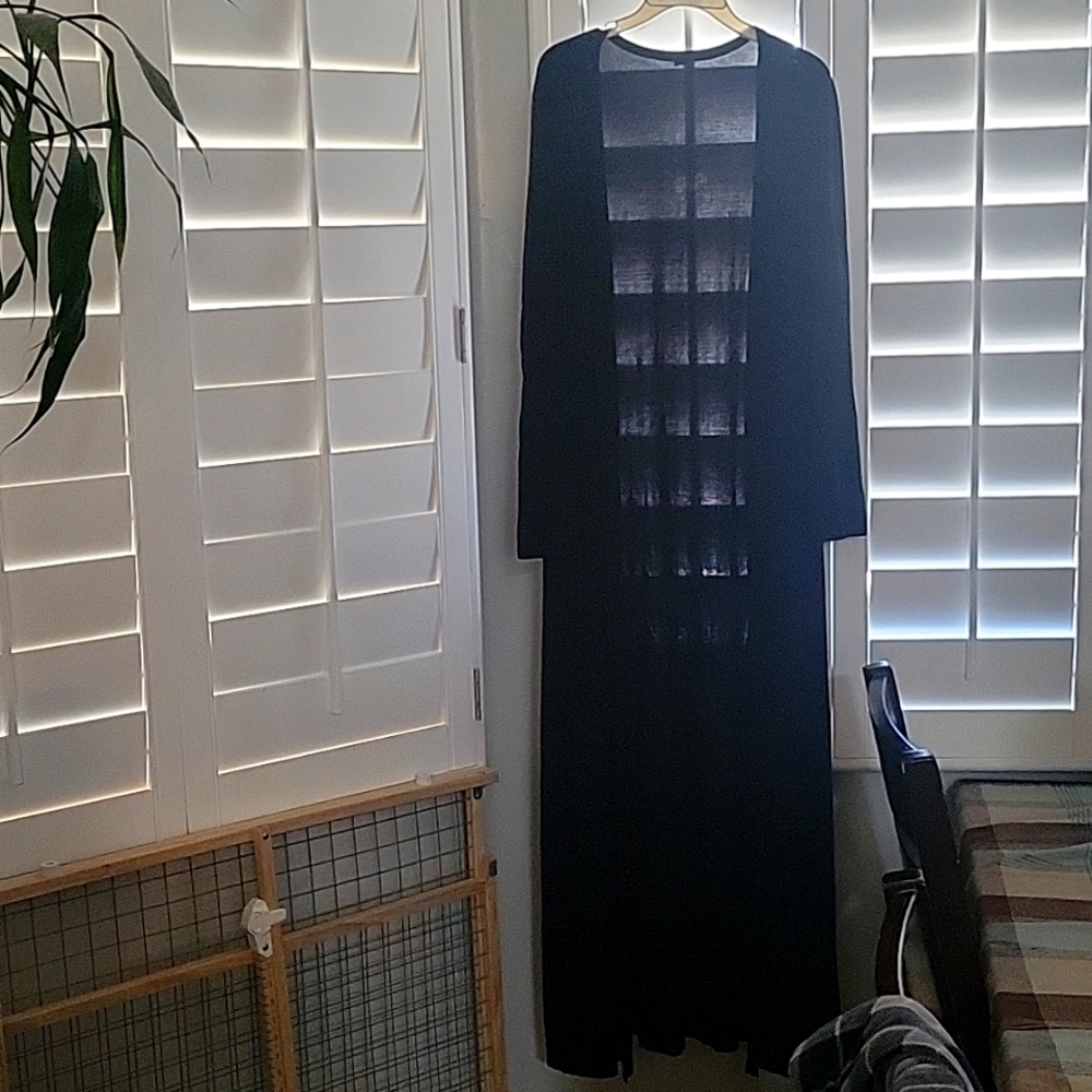 Long black light weight cover without buttons.